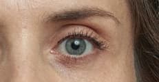 Close facial analysis of a grayish-blue iris